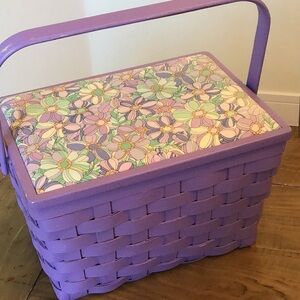 Lavender-colored woven sewing basket featuring a floral fabric top